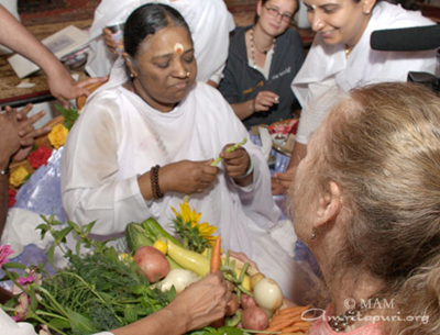 Amma inspects Turtle Barn produce