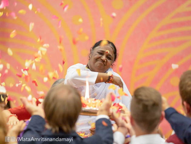 Amma thrwoing flower petals