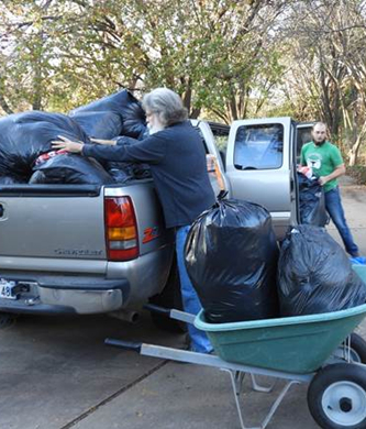 Denton Walker and Tom Tarr load the bags