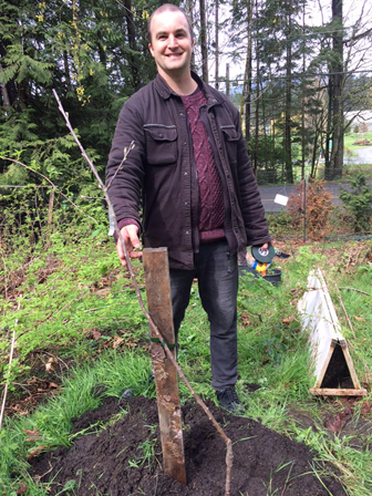 David with a heritage apple tree planted on a small acreage