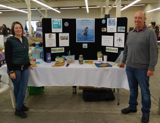 Diya and Richard at the farmer's market booth