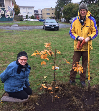 Vijaya and Chris with the Gary Oak  planted at an art school